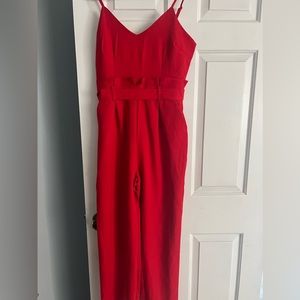 Never Worn Red Fashion Nova Romper w/pockets & ties in the back!